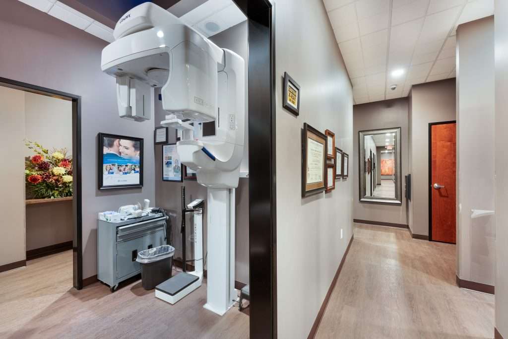 Cone beam 3D CT machine and hallway at Sacramento Dentistry Group used for implant planning and diagnostic imaging